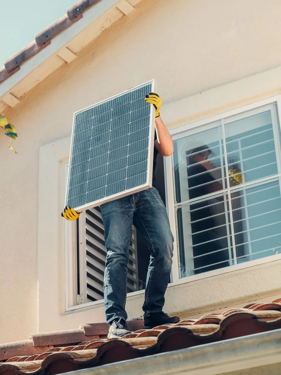 Helioura engineers inspecting a rooftop array