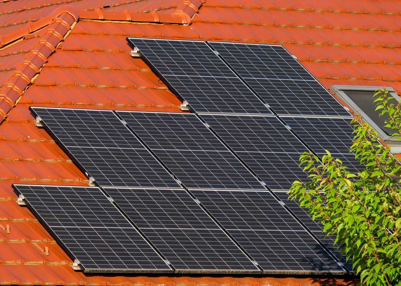Home with rooftop solar at dusk