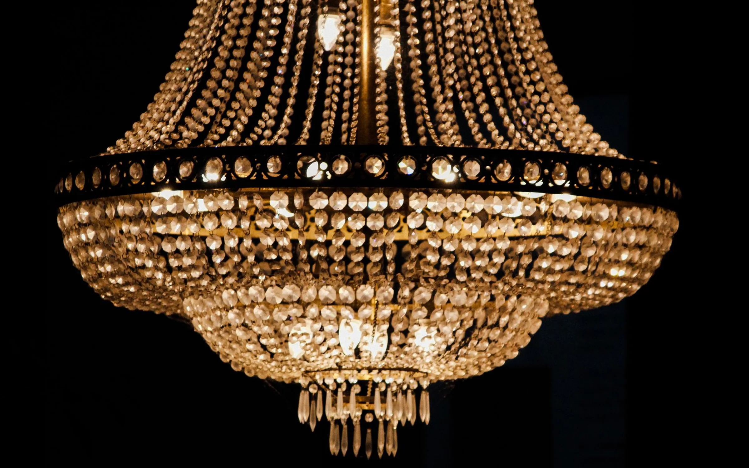 A crystal chandelier glowing in the dark