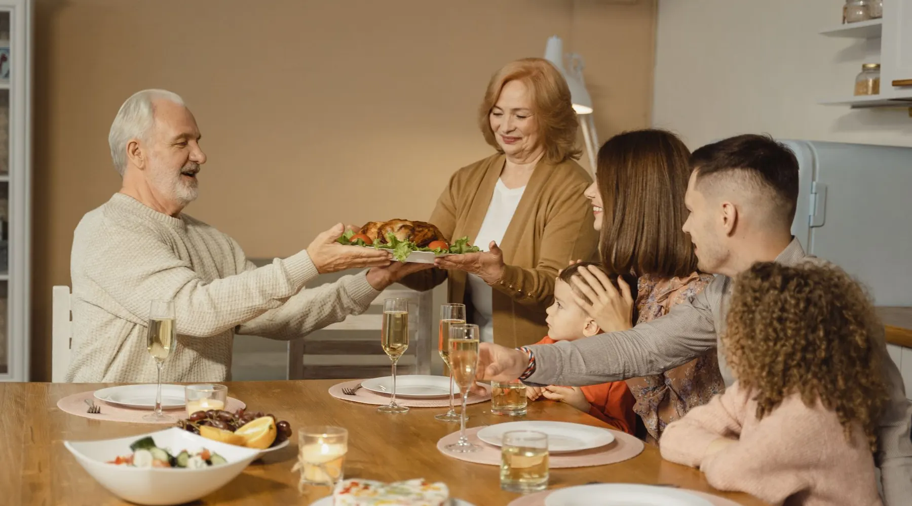 Three generations sharing a meal