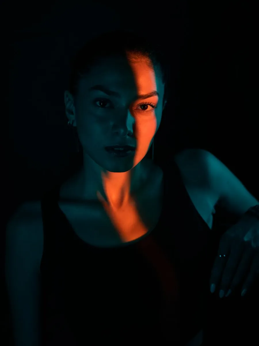 Portrait lit in teal and amber — from a Kanso campaign shoot