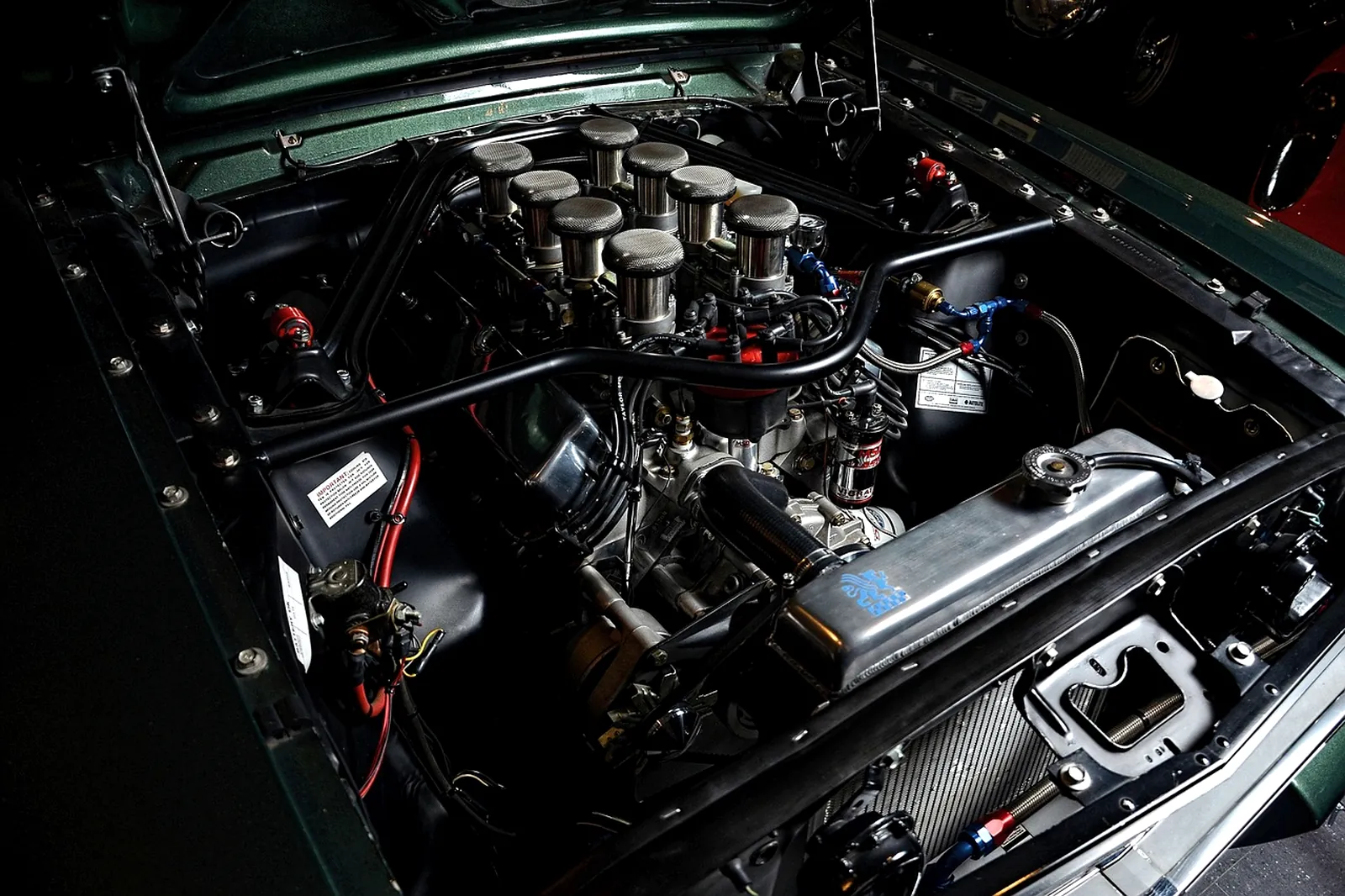 A mechanic working in an engine bay