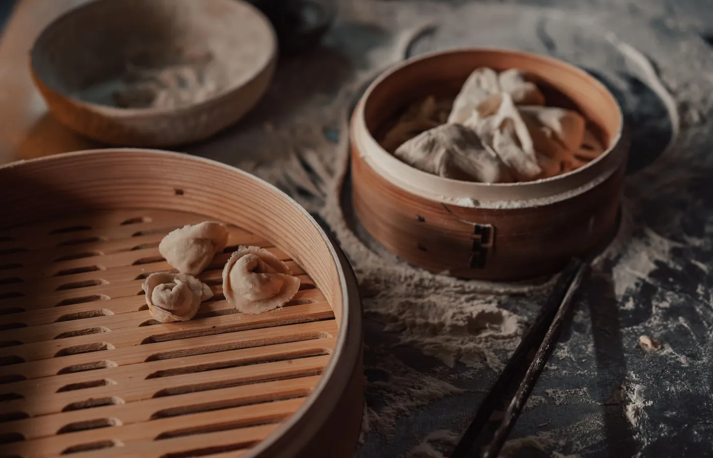 Hand-folded dumplings in bamboo steamers